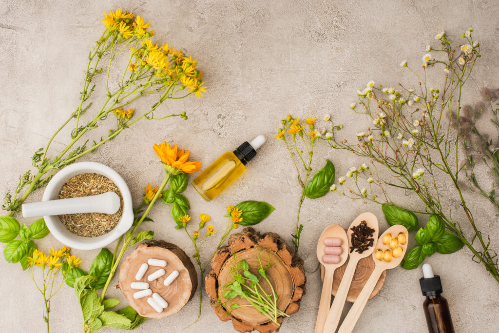 Flat lay of essential oils and herbs